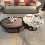 Designer Nesting Coffee Tables with Organic Curves and Layered Silhouettes